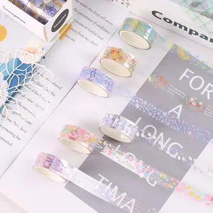 Detailed view of transparent PET flower washi tape rolls for DIY journals.