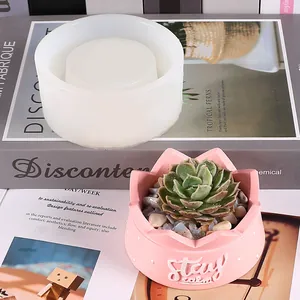 Detail of silicone mold and finished pink succulent pot with Stay Calm relief