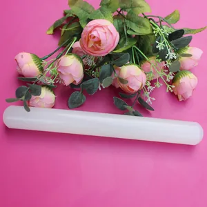 Macro view of white non-stick plastic rolling pin for fondant DIY baking and cake modeling