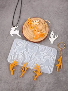 Detail view of DIY Christmas reindeer and antler silicone mold with resin samples