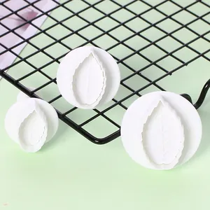Close-up detail of 3pcs white rose leaf plunger cutters for cake fondant decorating