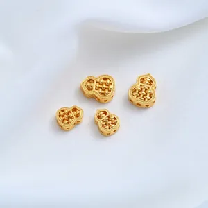 Detailed macro view of 24K gold plated gourd-shaped abacus spacer beads for DIY jewelry