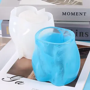 Detail view of torso shaped silicone mold and marble blue resin flower pot craft
