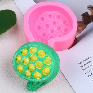 Close-up of pink lotus pod silicone mold with textured green finished craft for DIY crafts