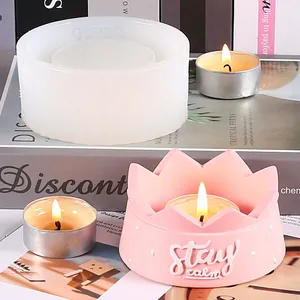 Detailed view of DIY silicone mold and finished pink crown candle holder with lit candle