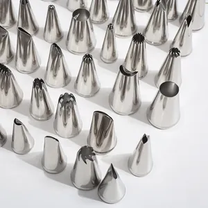 Macro detail view of various medium size 304 stainless steel icing piping tips for DIY baking