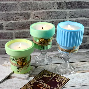 Detailed view of colorful flower pot candles made from DIY silicone molds in a rustic setting