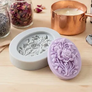Macro detail view of oval rose floral silicone mold and finished purple wax craft piece