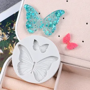 Detailed macro view of butterfly silicone mold with finished glitter resin samples