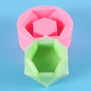 Hexagonal silicone mold for DIY succulent planters and candles shown with green sample