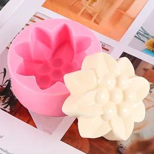 Macro view of flower shaped DIY silicone mold with finished white soap accessory