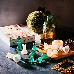 Detailed macro view of 3D resin chess pieces featuring glitter green and matte white finish
