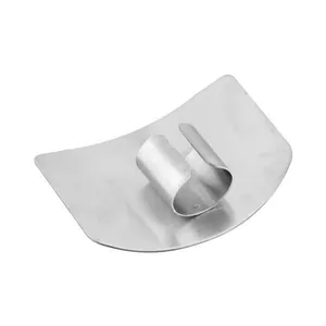 Detailed view of a durable stainless steel finger guard for safe and easy vegetable cutting.