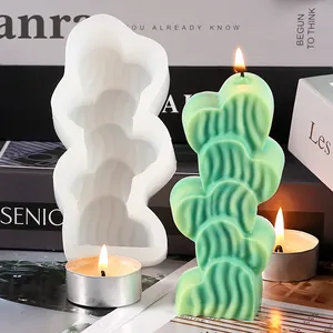 Detail view of 5-heart stack silicone mold with green candle showing textured patterns