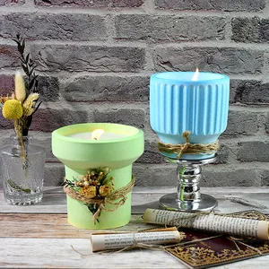 Handmade scented candles in green and blue flower pot holders made with DIY silicone molds