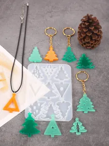 Detail of DIY Christmas tree silicone mold with finished resin pendants and keychains
