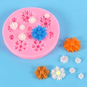 Detail view of pink silicone daisy mold with colorful finished resin flower pieces