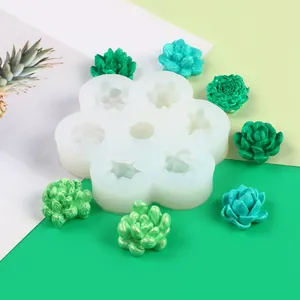 Detail view of 7-cavity silicone mold with various succulent and flower shapes