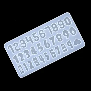 Detailed view of translucent silicone number mold featuring three different digit fonts