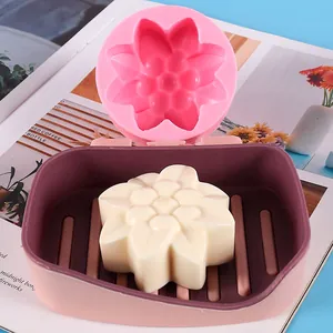 Detail view of a chrysanthemum silicone mold with a finished white flower soap.