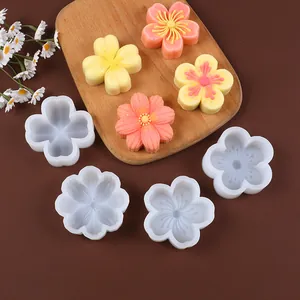 Detailed macro view of DIY flower silicone molds for cherry blossom and clover mousse cakes