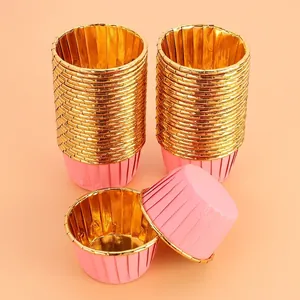 Detail of pink and gold foil muffin cupcake liners showing 6.4cm by 3.8cm dimensions