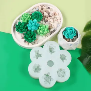 Macro view of 7-hole succulent silicone mold with finished floral candle pieces