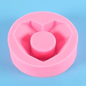 Detail view of pink silicone mold with a geometric heart-shaped cavity for succulent pots