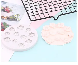 Close-up of floral silicone mold with sunflower and rose patterns for DIY baking