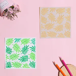 Detail showing leaf pattern DIY painting stencil with a sample output on pink background