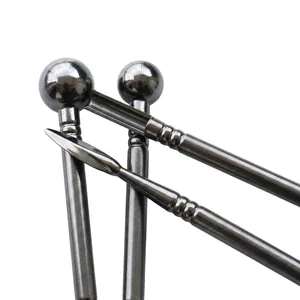 Detailed close-up of professional black plastic sculpting tools for fondant and clay modeling