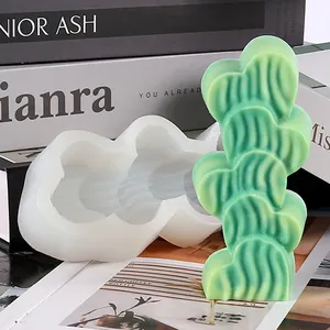 Detail shot of the textured heart-shaped silicone mold with a finished green candle