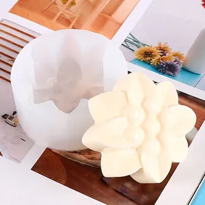 Detailed view of a sunflower silicone mold and a finished pale yellow flower craft piece.