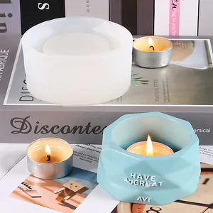 Close-up detail of DIY silicone mold and a finished light blue geometric candle holder