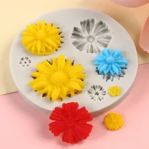 Detailed floral silicone mold featuring sunflower and daisy shapes for DIY cake decorating.