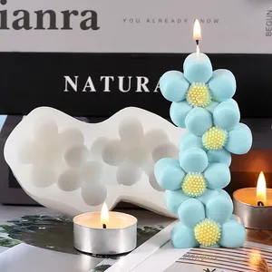Close-up of DIY sun flower silicone mold with finished light blue flower candle