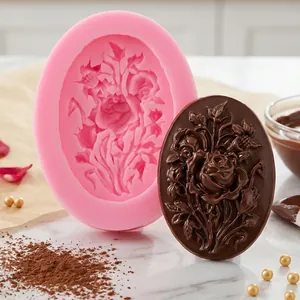 Detail view of an oval rose flower silicone mold and its finished chocolate decoration.