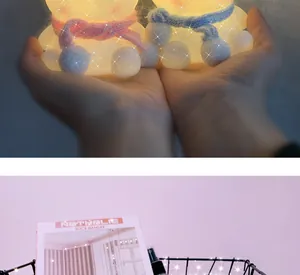 Atmospheric soft glowing rabbit-shaped LED night lights held in hands for cozy bedroom decor