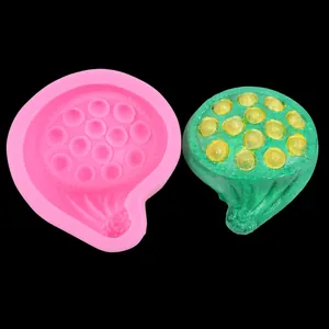 Macro view of lotus pod silicone mold with a textured green finished product example