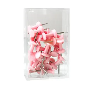Pink decorative push pins in a clear storage box for cork boards and office photo walls