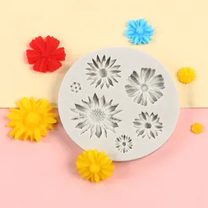 Detailed view of daisy flower silicone mold with finished colorful resin pieces