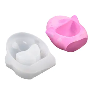 Detailed macro view of translucent and pink silicone molds for DIY resin and candle making