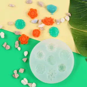 Vista detallada del molde de silicona de flor de loto 3D con muestras de cera