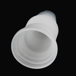 Detailed view of stacked white plastic piping tip couplers for cake decorating tools