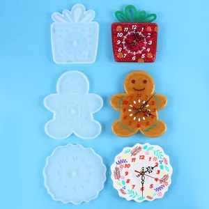 DIY silicone resin clock molds showing finished gingerbread man and fruit wall clocks