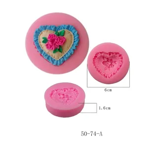 Close-up view of a pink heart silicone mold featuring an intricate rose flower pattern