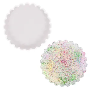 Detailed view of a scalloped silicone mold with a glittery finished resin coaster.