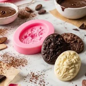 Detailed macro view of an oval floral silicone mold with finished rose chocolates