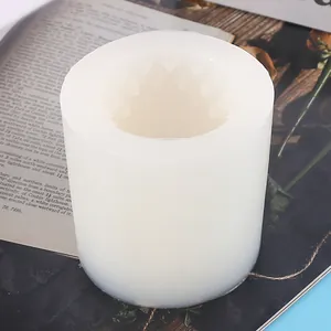 Close-up of white cylindrical silicone mold with star-shaped geometric inner pattern