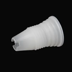 Close-up of white plastic piping tip coupler for cake decorating and baking tools